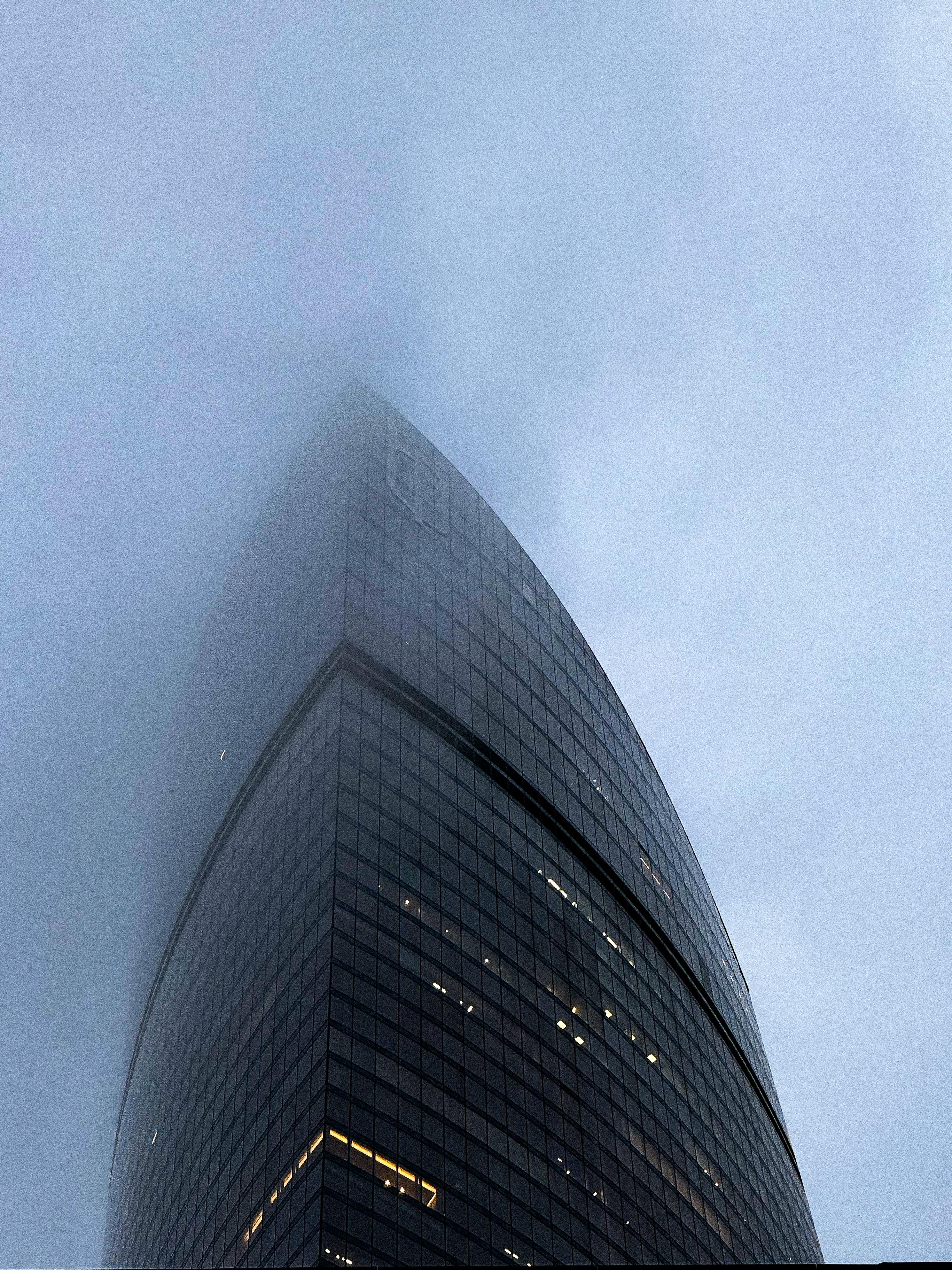 Federation Tower East disappearing into fog — 374 meters of glass and steel
